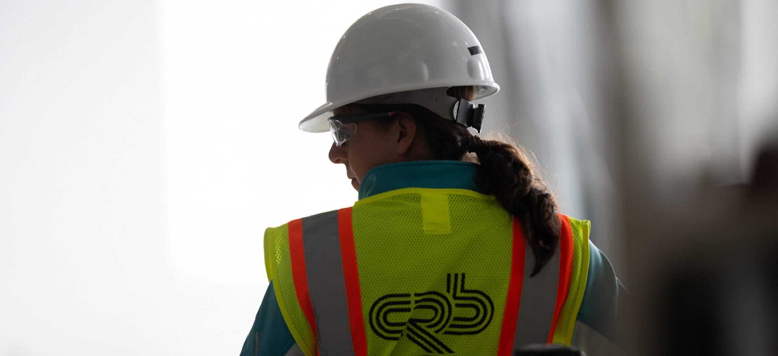 Female CRB construction employee in personal protection equipment