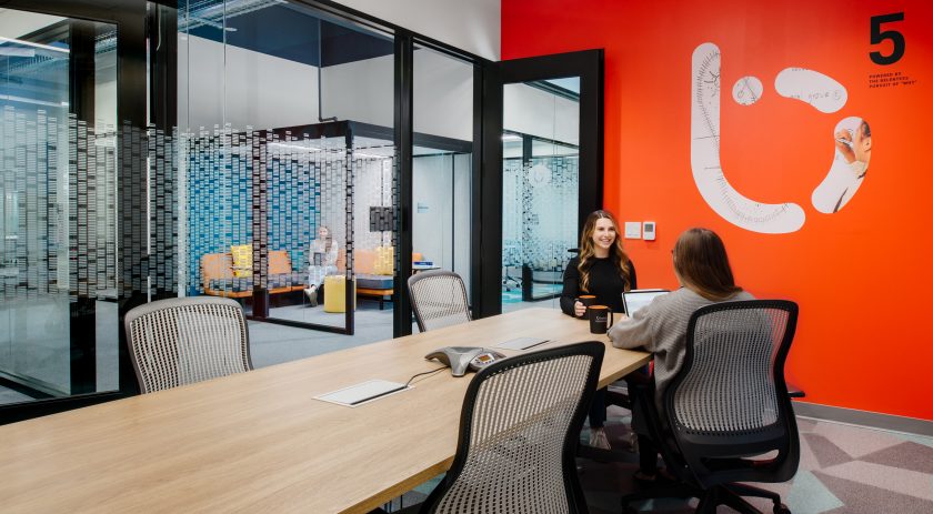 Conference room with large windows and colorful walls