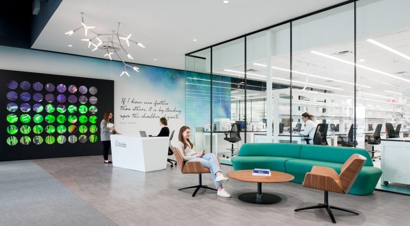Bright office entry, lab and meeting space inside a coworking facility, promoting collaboration