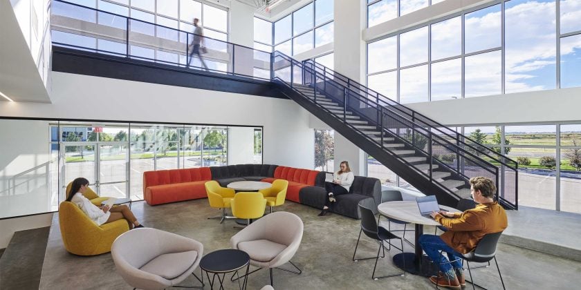 modern startup style collaboration space in orange and grey