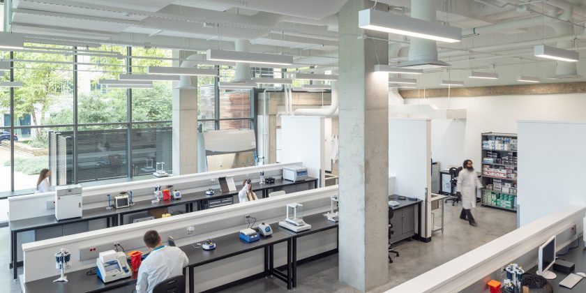Quality Control Lab with large windows and advanced lab equipment.