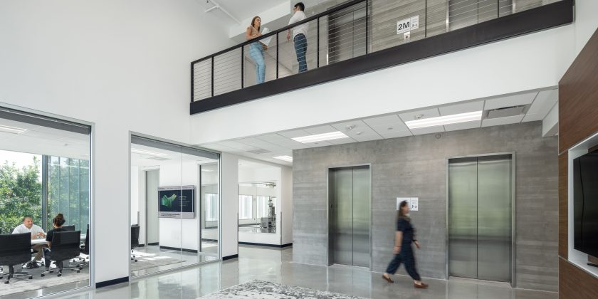 Open office space with mezzanine overlooking the lobby and conference rooms.