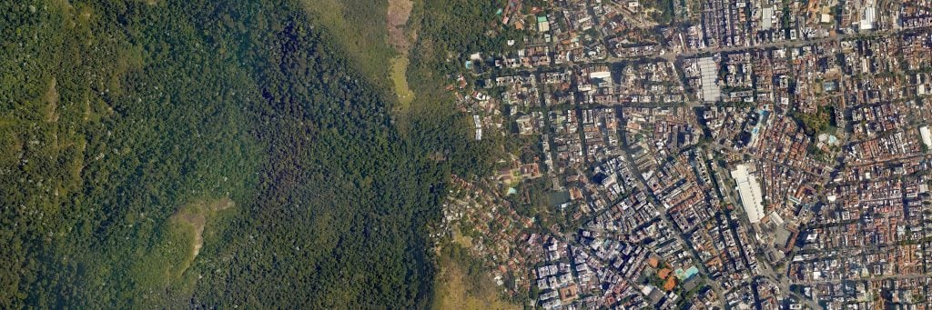 aerial view of greenfield land and city