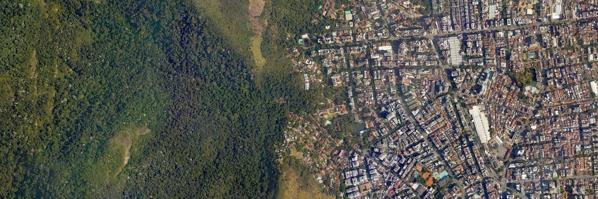 aerial view of greenfield land and city