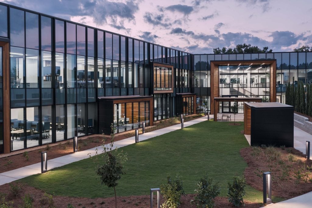 R&D building's modern glass and wooden architecture from courtyard